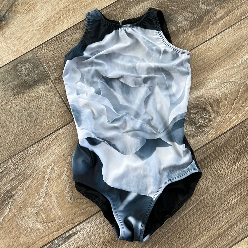 Voltare designs XS Leo. is black with a floral lite to med. gray. Like new.